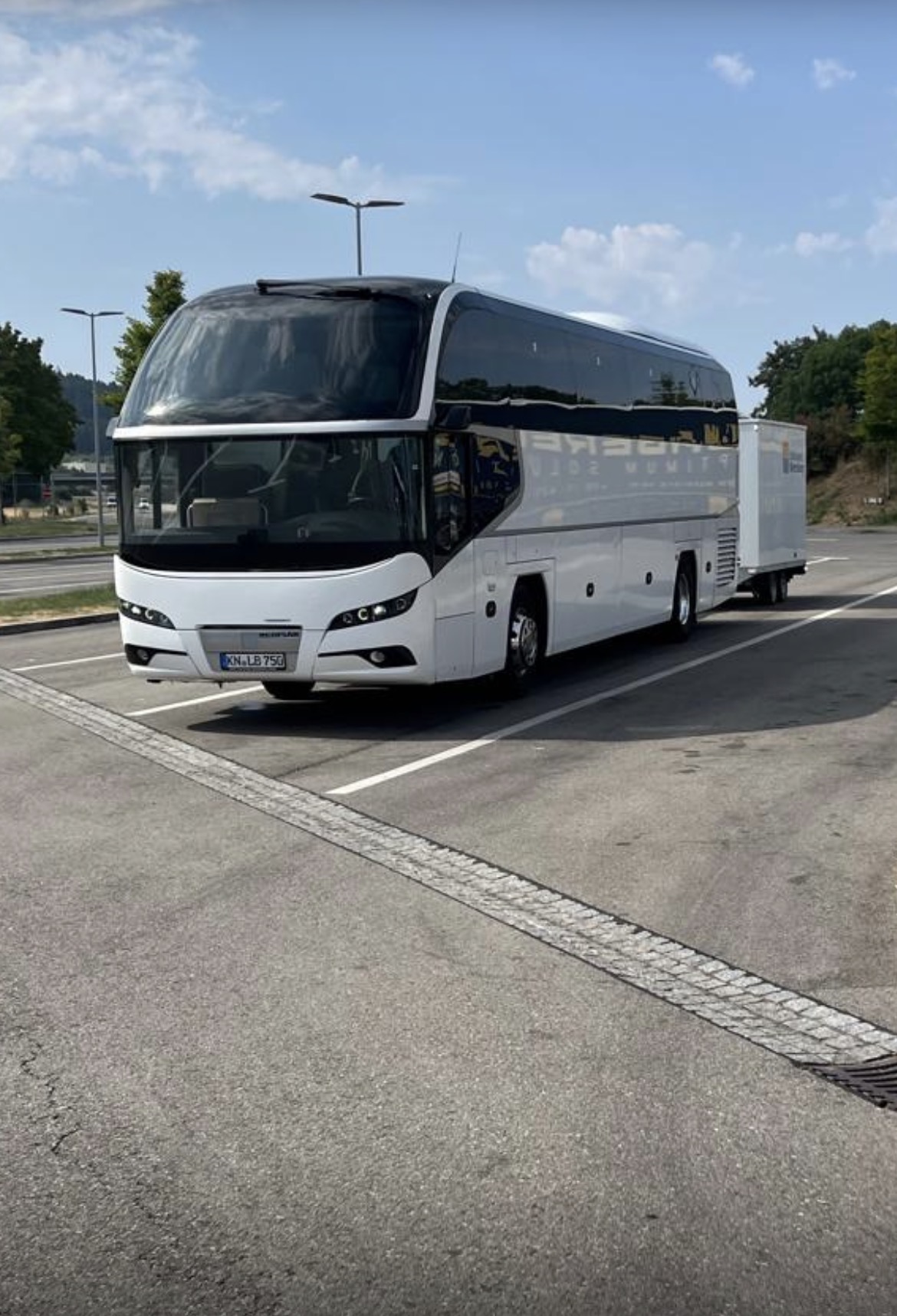 Tour coach with instrument trailer