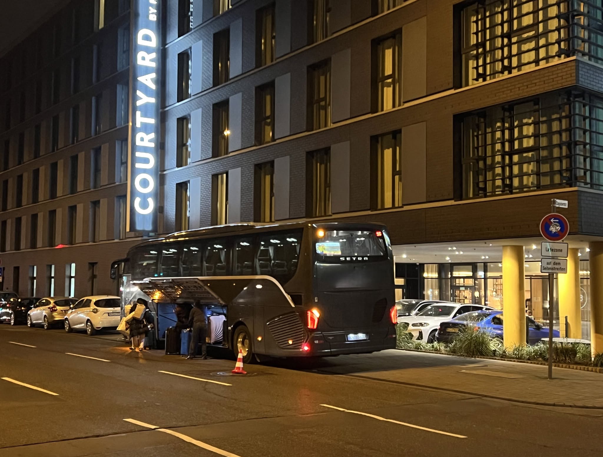Tour coach unloading at group hotel