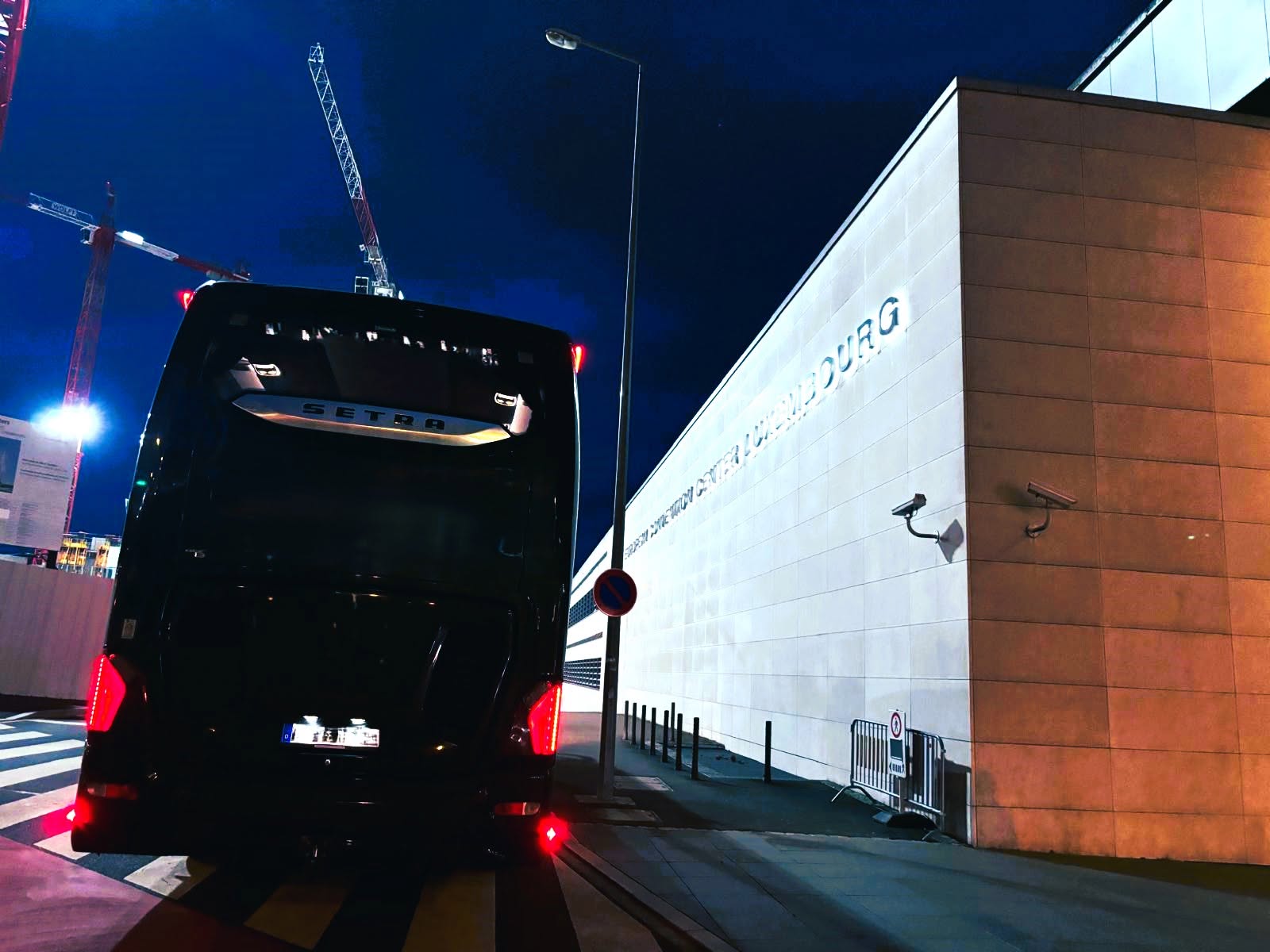 Tour coach at Philharmonie Luxembourg at night